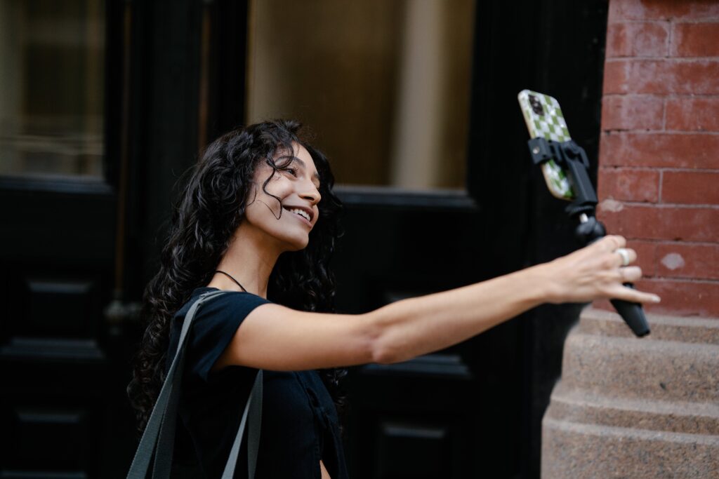 Image of a woman taking a selfie because she loves herself