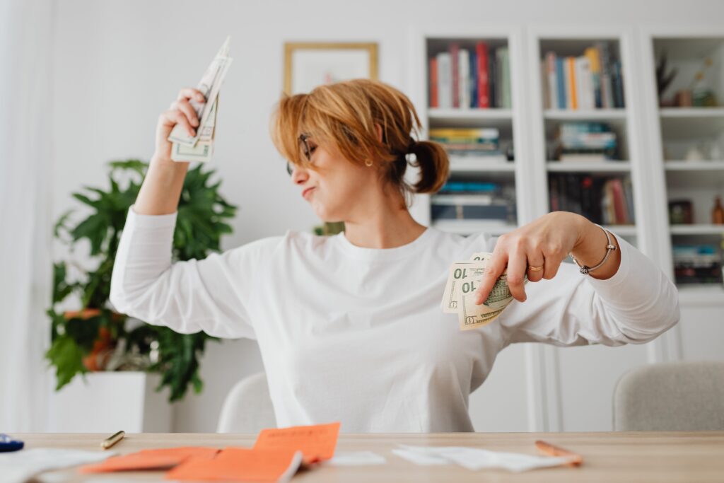 Image of a women counting her money and being happy